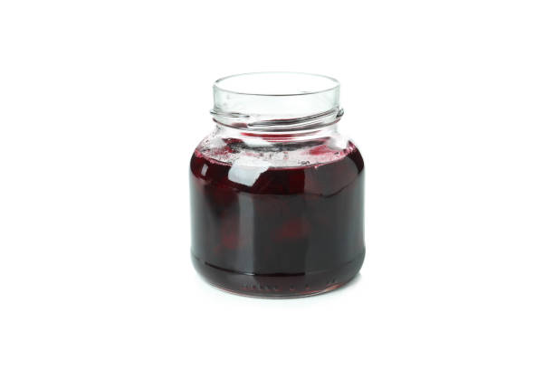 istock Tasty cherry jam isolated on white background 1445970675