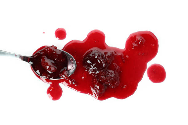 istock Tasty cherry jam isolated on white background 1445970781