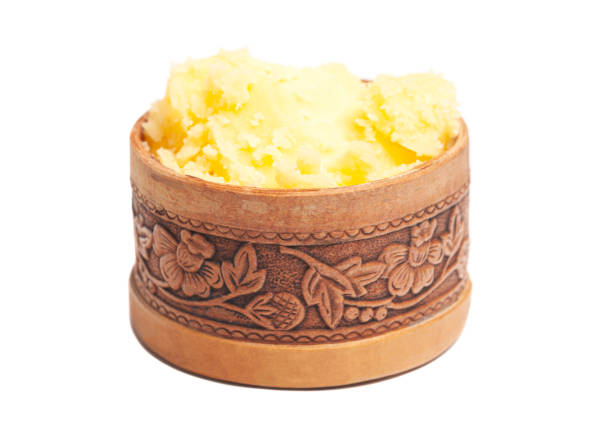 istock Ghee in wooden bowl isolated on white background 1445970973
