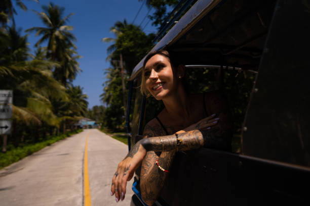 istock Female tourist looking through car window and admire the view 1445971090