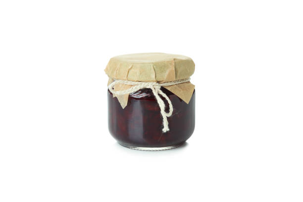 istock Tasty cherry jam isolated on white background 1445971160