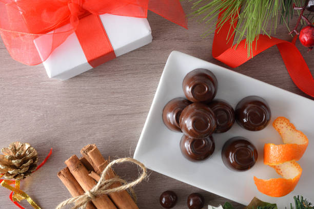 istock Chocolate candies detail on table with Christmas decorations top view 1445971237