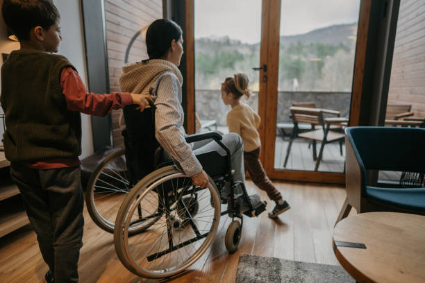 istock Cute kids helping their disabled mother 1445973399