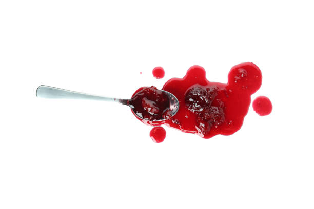 istock Tasty cherry jam isolated on white background 1445974131