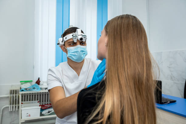 istock woman came for an appointment with a doctor who performs an examination 1445976709