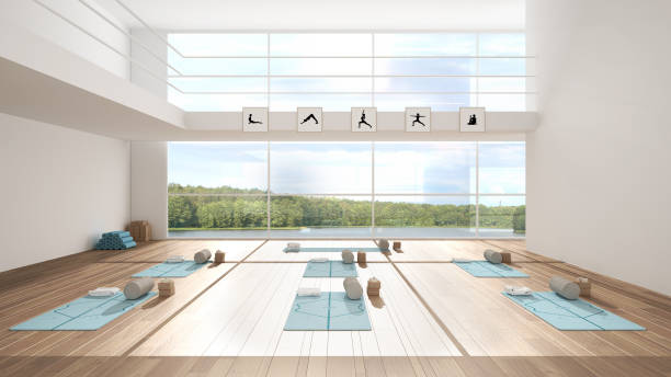 Empty yoga studio interior design architecture, minimal open space, spatial organization with mats, and accessories, ready for yoga practice, panoramic window with lake panorama stock photo