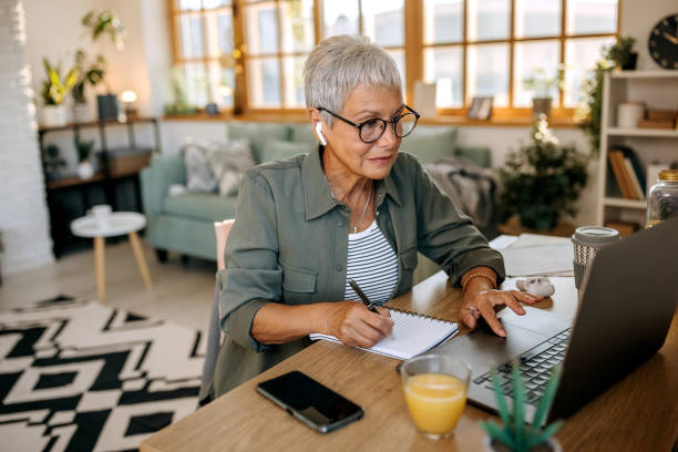 istock Senior woman working from home 1445981979