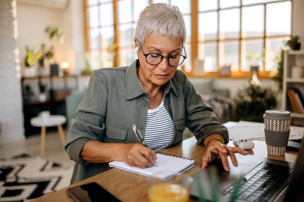 istock Senior woman working from home 1445981980