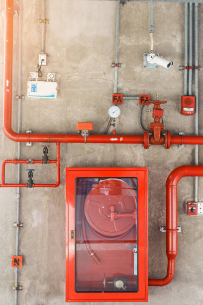 istock Fire extinguisher and water pump system on the wall, powerful emergency equipment for apartment and hotel 1445984838