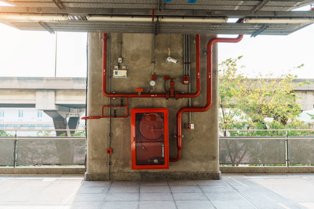 istock Fire extinguisher and water pump system on the wall, powerful emergency equipment for apartment and hotel 1445984840
