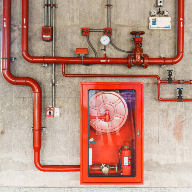istock Fire extinguisher and water pump system on the wall, powerful emergency equipment for apartment and hotel 1445984868