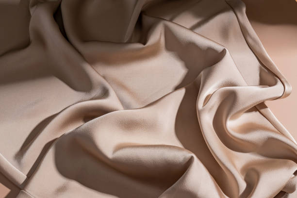 istock Smooth elegant bronze beige silk or satin luxury cloth texture background. Luxurious background design. 1445984982