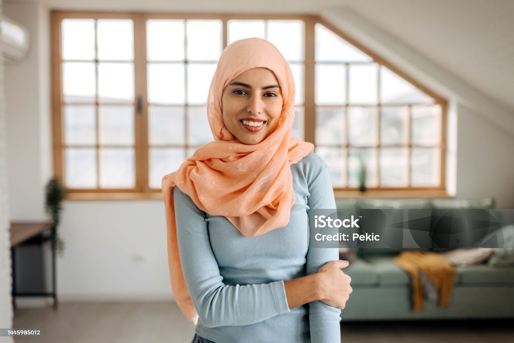 Portrait of confident beautiful hijab woman in apartment 30-34 Years Stock Photo