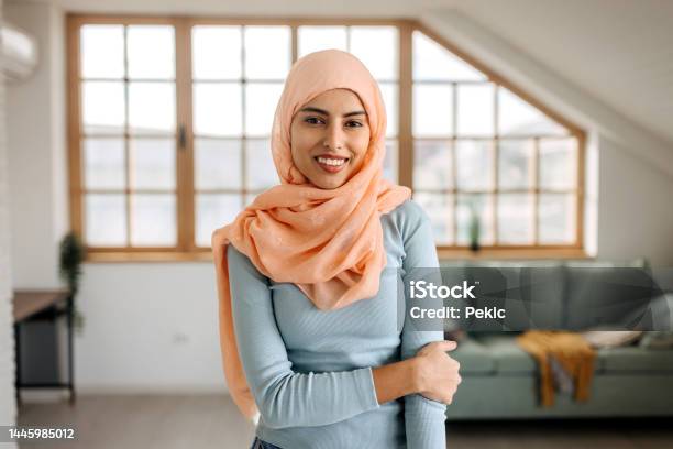 Portrait Of Confident Beautiful Hijab Woman In Apartment Stock Photo - Download Image Now