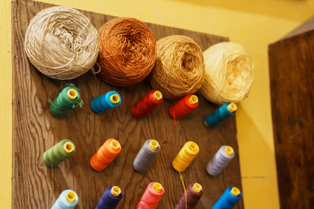 istock Colorful yarn on spool, thread on tube, cotton wool. Tailor concept 1445985095