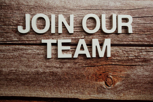 istock Join Our Team alphabet letter on wooden background 1445989621