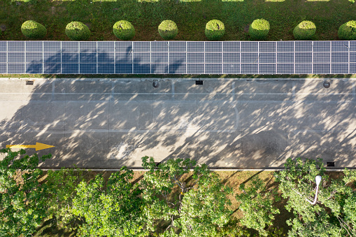 Aerial view of solar panels on sidewalk roof
