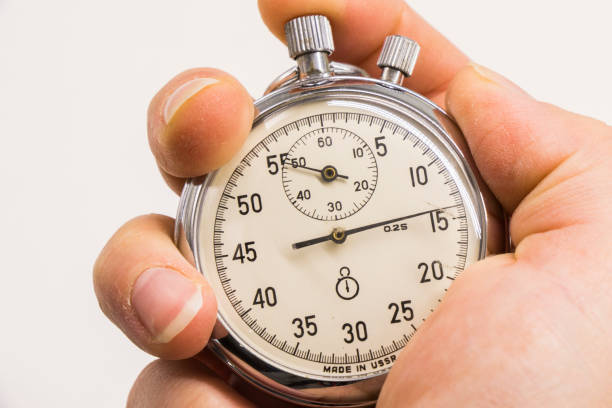 istock Old antiquary timer clock and humans hand 1445991586