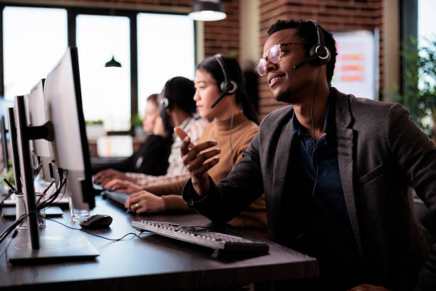 istock Reception secretary answering client phone call at customer service 1445991732