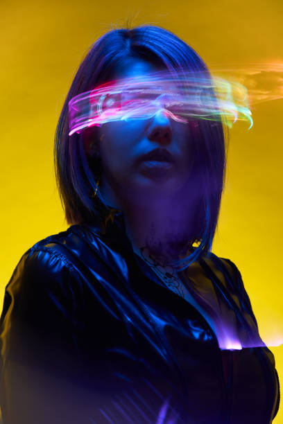 istock Woman is using augmented reality headset. Concept of virtual, augmented and extended reality. 1445991875