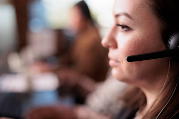 istock Call center assistant helping people on telemarketing network 1445992903