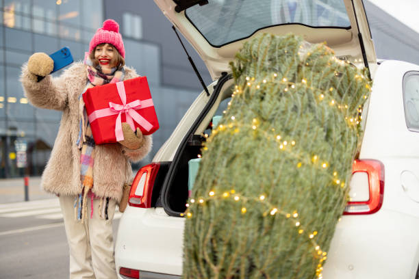 istock Woman talks on phone while shopping for a winter clothes 1445994126