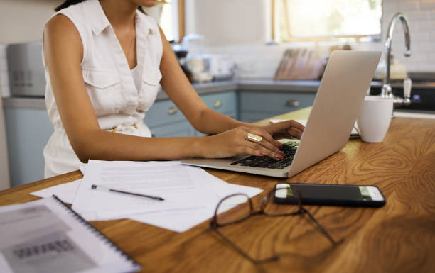 istock Business woman hands, laptop or research in kitchen for analytics, creative strategy or innovation website dashboard update. Networking, ecommerce working with tech or data analysis planning agenda 1445995833