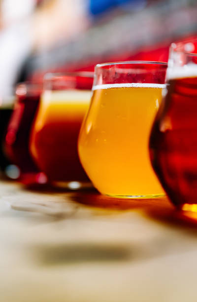 istock Glasses with different craft beer on wooden bar counter 1445996903