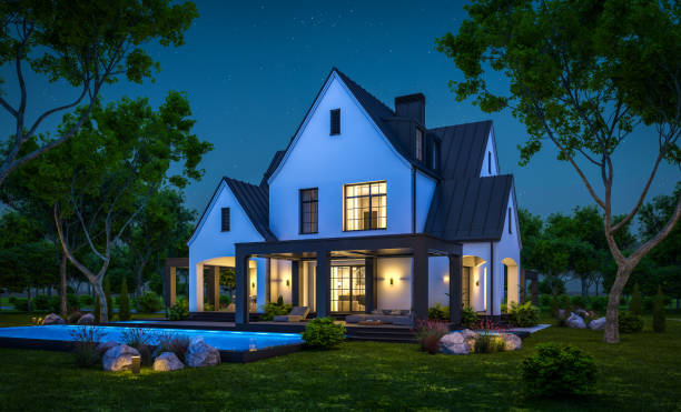 istock 3d rendering of white and black modern Tudor house in night 1445998951