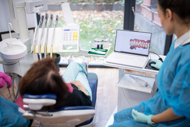 istock Dental procedure with the help of 3D tooth scanner technology. 1445999428