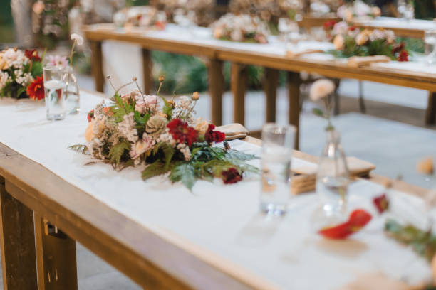 istock Wedding reception night dinner setup table with beautiful flower decoration. 1445999572