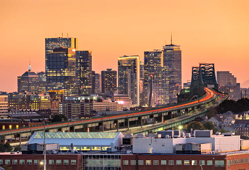 Illuminated Office Buildings and Interstate Traffic at Dusk, View From North Boston