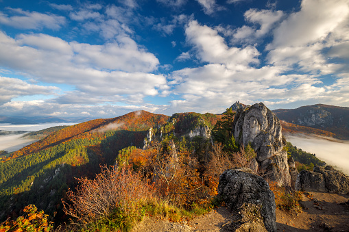 Scenic view of autumn mountain landscape with foggy valley. The Sulov Rocks, national nature reserve in northwest of Slovakia, Europe.