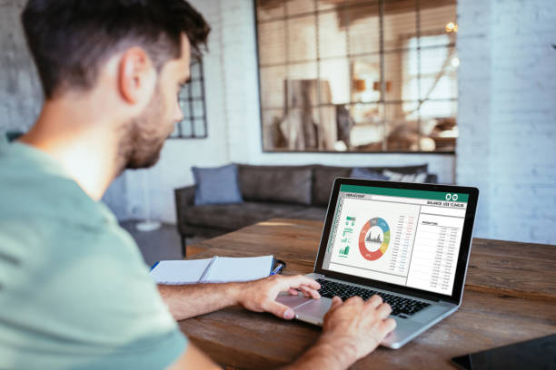istock Unrecognisable man using electronic banking on laptop at home, dealing with investments and finances 1446007787