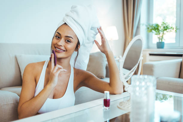 istock Young woman massaging her face. 1446011062
