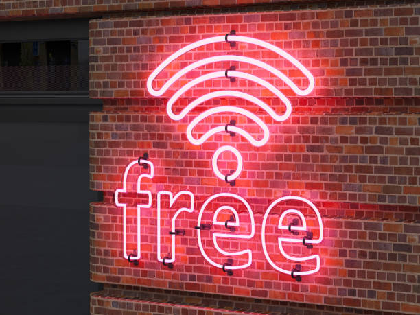 sinal de néon wi-fi gratuito na parede de tijolos do café - mobile internet - fotografias e filmes do acervo