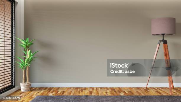 Unfurnished Interior With Empty Wall With Green Plant And Floor Lamp Stock Photo - Download Image Now
