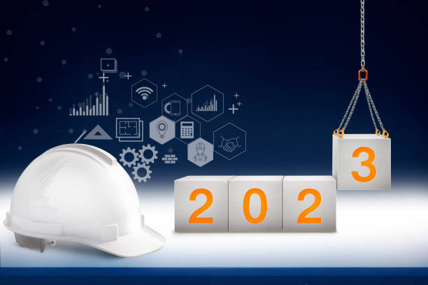istock engineer working table and lifting concrete cube by crane construction for welcome 2023 new year, start new project and construction graphic design in background 1446014970