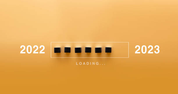 istock Loading new year 2022 to 2023 with hand putting wood cube in progress bar. Start new year 2023 with goal plan, goal concept, strategy. 1446025197