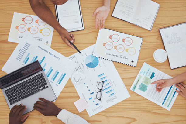 istock Planning, marketing and business hands with documents for finance report, seo analytics and chart graph analysis. Team collaboration, strategy meeting and profit, budget and sticky note idea planner 1446026659