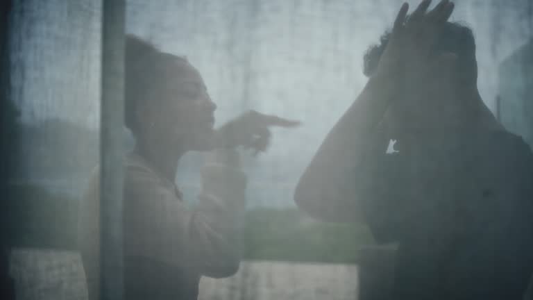 Unhappy african ethnicity couple fighting and yelling on the balcony. Relationship crisis