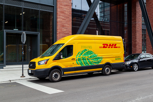 Chicago, Illinois, USA - March 29, 2022: A DHL liquefied natural gas truck on the street. DHL International GmbH (DHL) is an international courier.