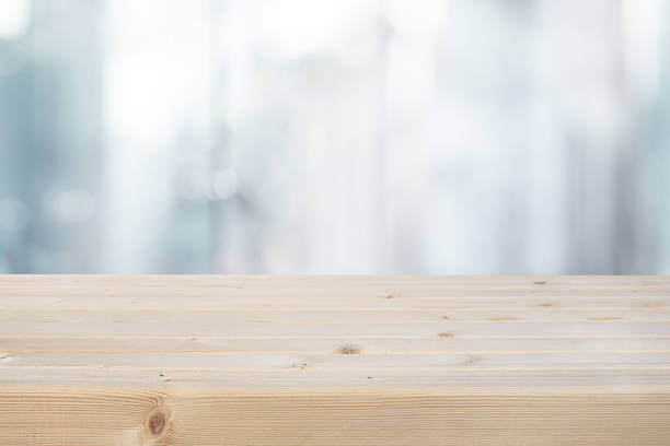 istock Selective focus.Top of wood table with blur window glass  background. 1446029643
