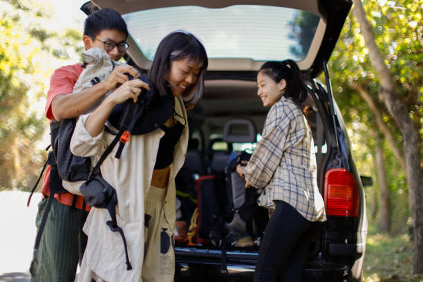 istock Climbing team unloads equipment from car 1446031589