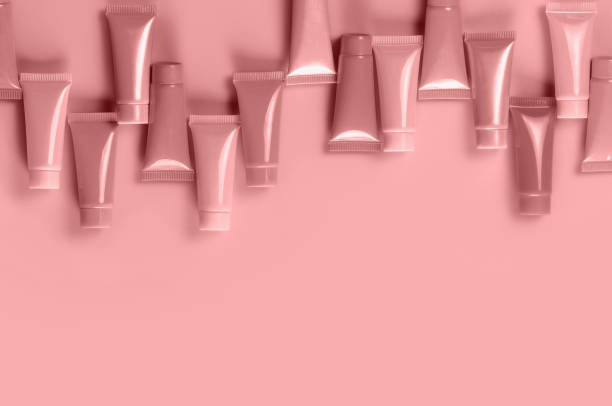 istock Empty tubes for the design of cosmetics on red background. 1446032236