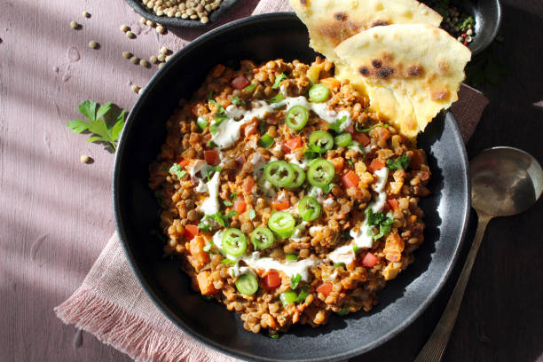 istock Lentil with vegetables served with naan bread. 1446032368