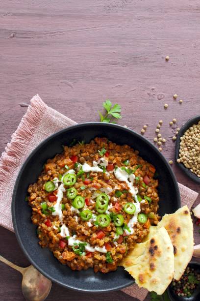 istock Lentil with vegetables served with naan bread. 1446032379
