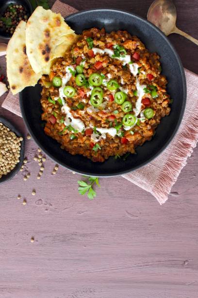 istock Lentil with vegetables served with naan bread. 1446032387