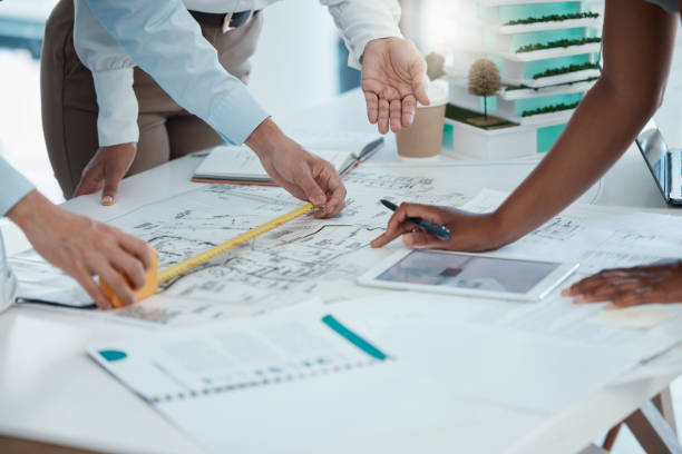 istock Blueprint, construction and architect team planning in meeting, drawing on paper and collaboration for building project. Hands working in architecture with strategy on document and tablet in office 1446034452
