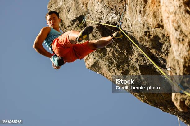 Man Challenging Rock Climbing On Limestone Wall Stock Photo - Download Image Now - Challenge, Achievement, Active Lifestyle
